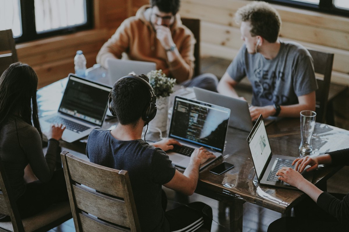 People working together at laptops